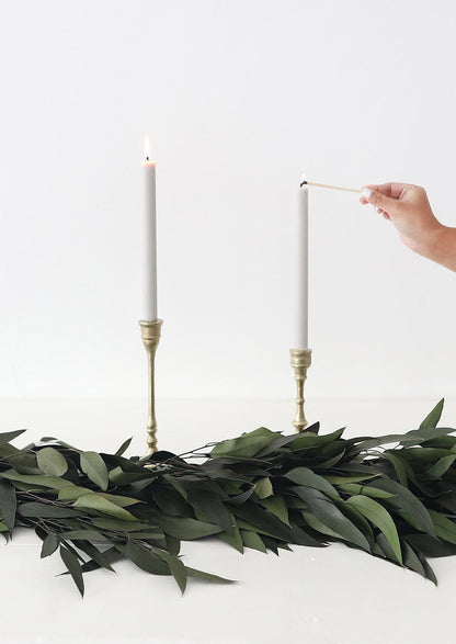 Green Preserved Weeping Eucalyptus Garland and Gold Candle Holders at afloral