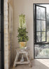 Potted Arrangement with Faux Delphinium Flowers at Afloral