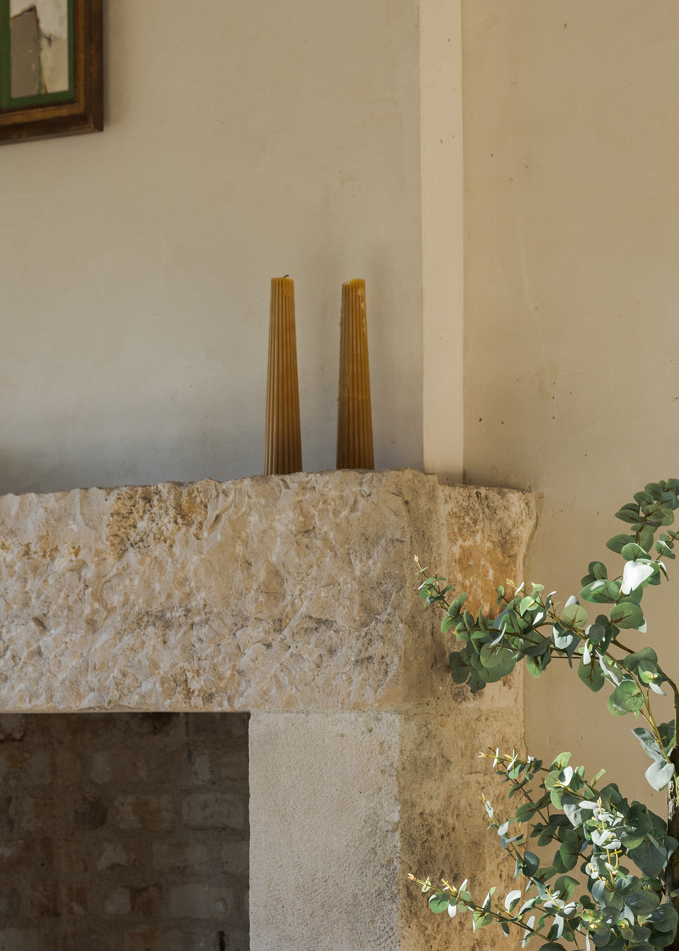 Afloral Fluted Pillar Candles on Fireplace Mantle