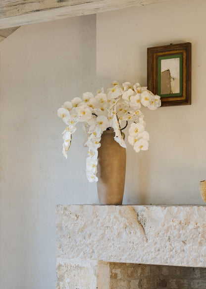 Artificial Orchids in White Styled in Tall Terra Cotta Vase